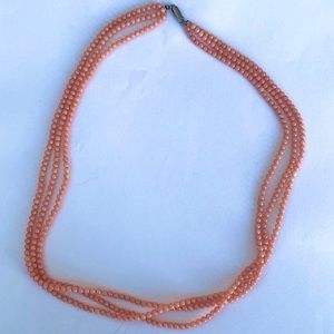 Three string coral beaded necklace